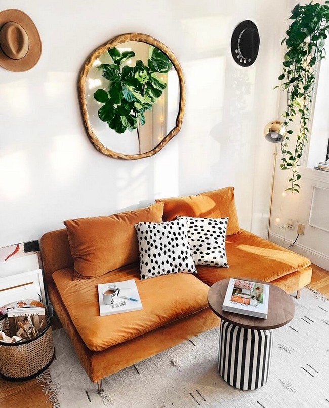 Burnt orange sofa and quirky throw pillows