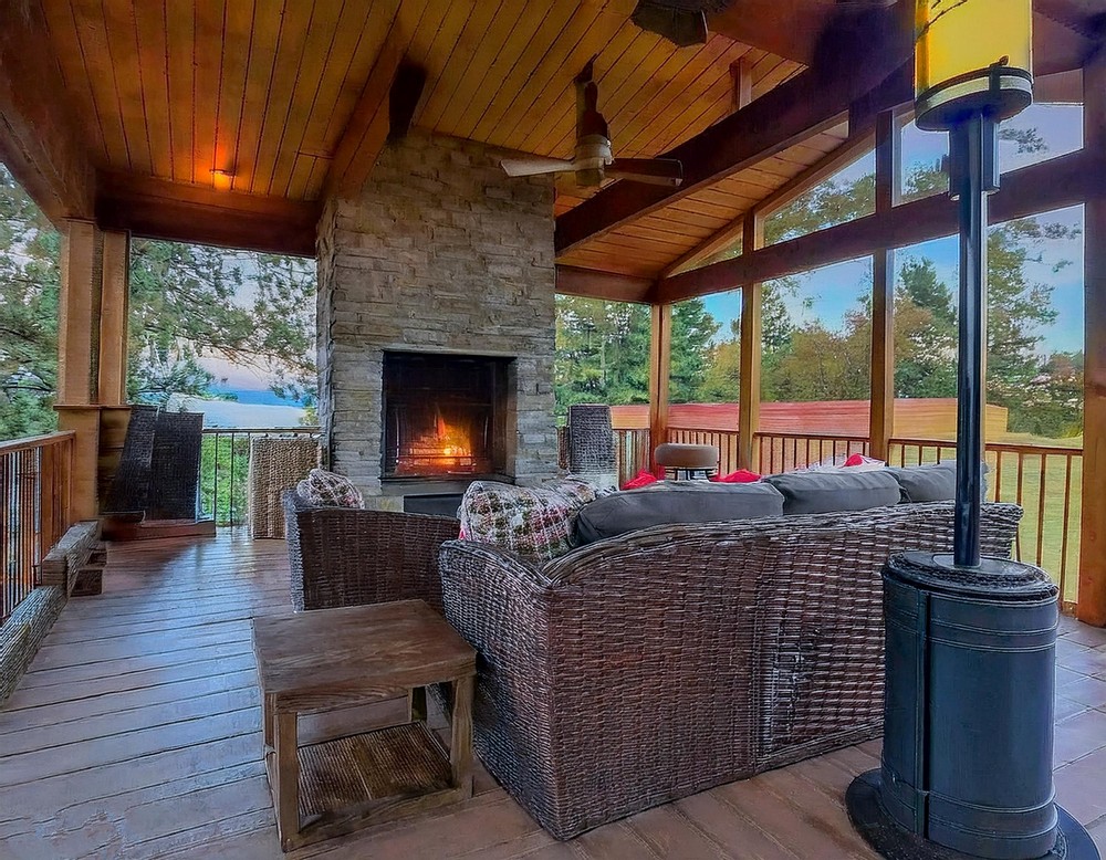 Screened In Porch With Fireplace And Tv